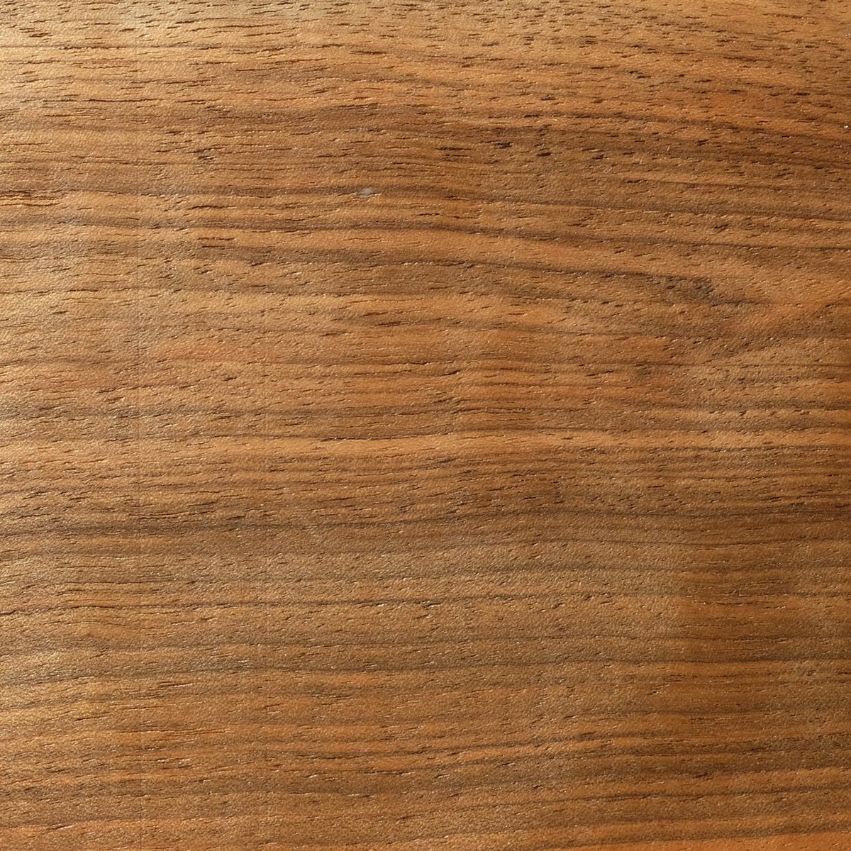 Close-up of walnut, deep chocolate brown with darker figuring
